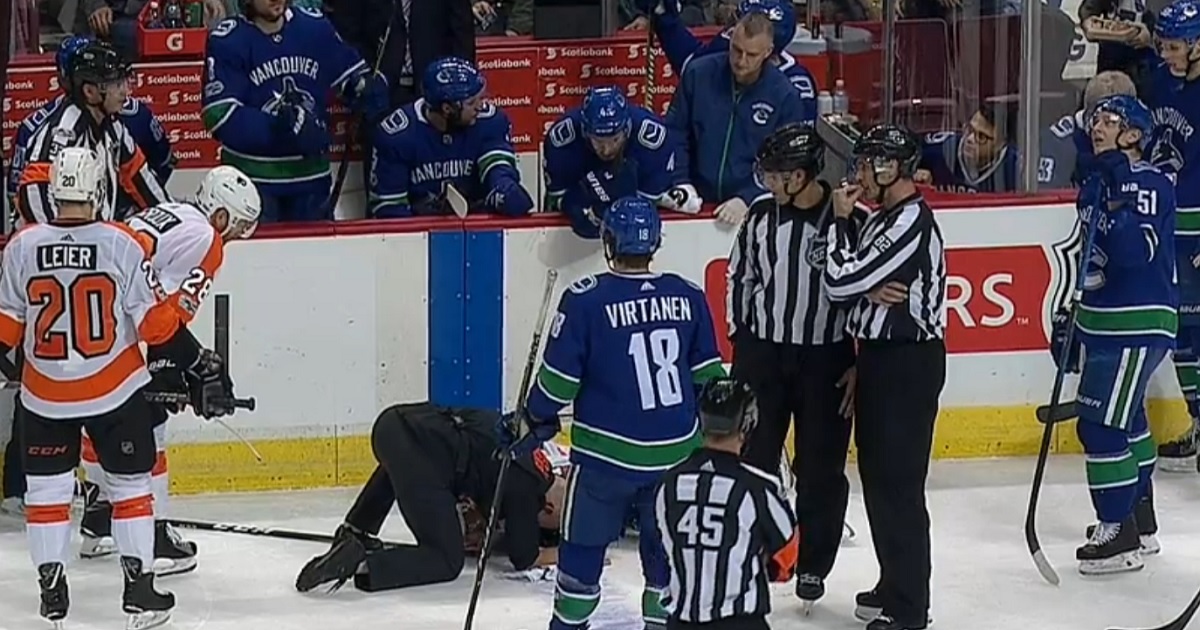 Young player injured after violent collision with NHL referee.