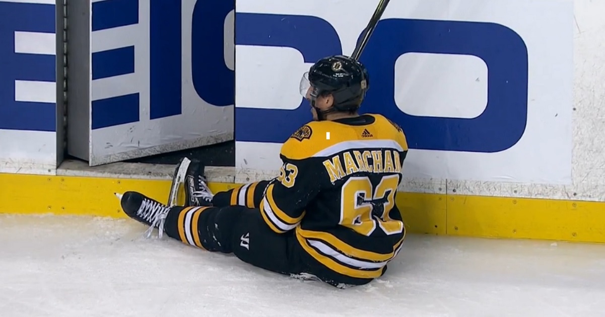 Brad Marchand takes a crosscheck to the chest and gets called for a penalty. 