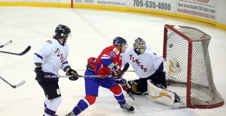 Paramedic goaltender saves a mans life in the crowd!