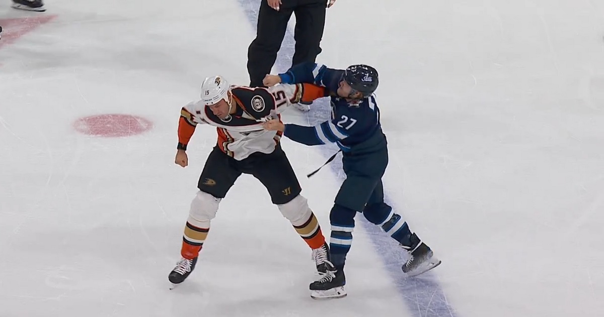 Nikolaj Ehlers drops the gloves with Ryan Getzlaf.