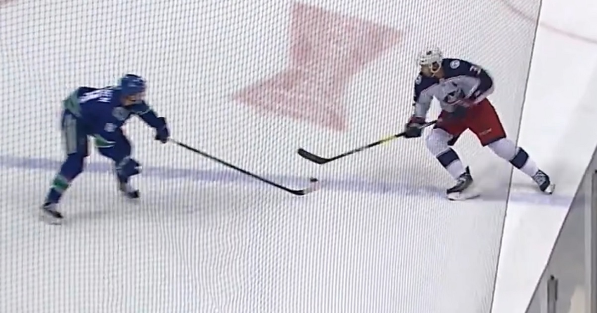 Jake Virtanen's hit misses Seth Jones and sends him face first into the boards.