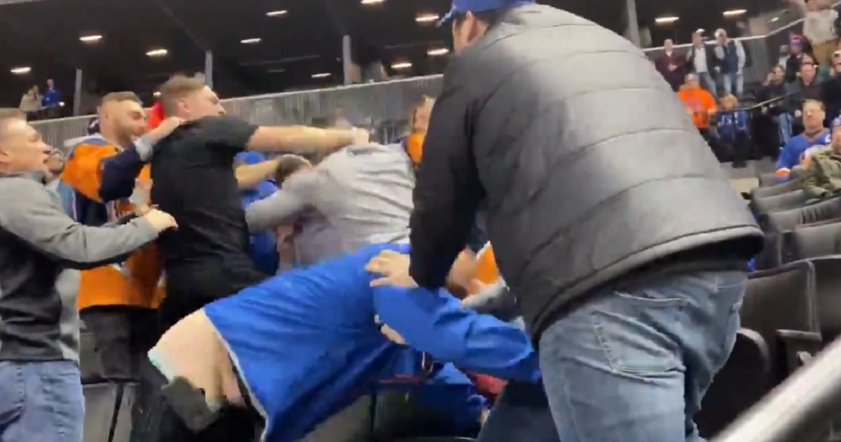 Brawl breaks out in the crowd at NHL game.