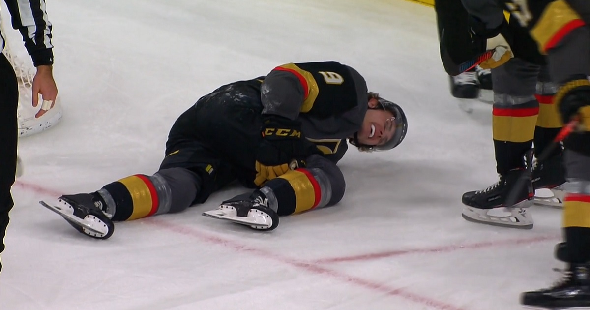 Cody Glass carried off the ice after falling awkwardly into the net.