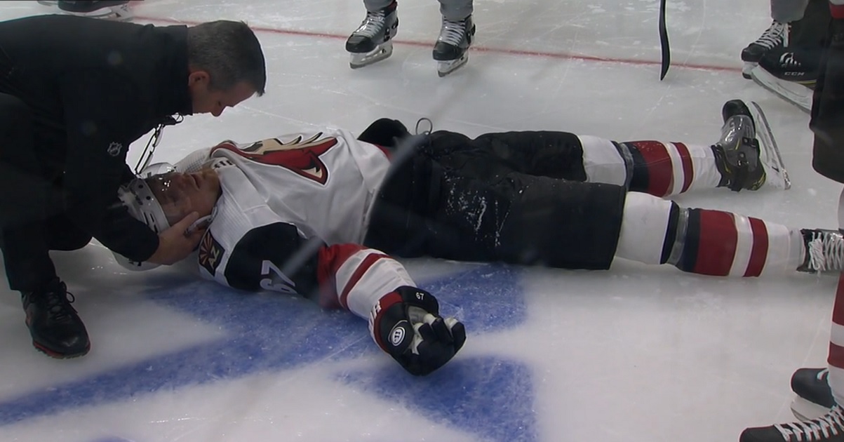 Lawson Crouse in bad shape after going head first into the boards.