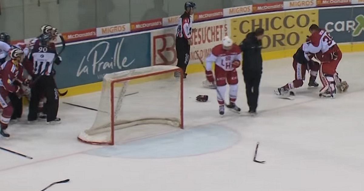 Former NHL goalie and former NHL forward drop the gloves.