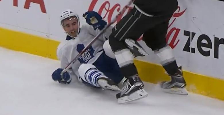 Milan Lucic knocks Nazem Kadri flat on his butt.