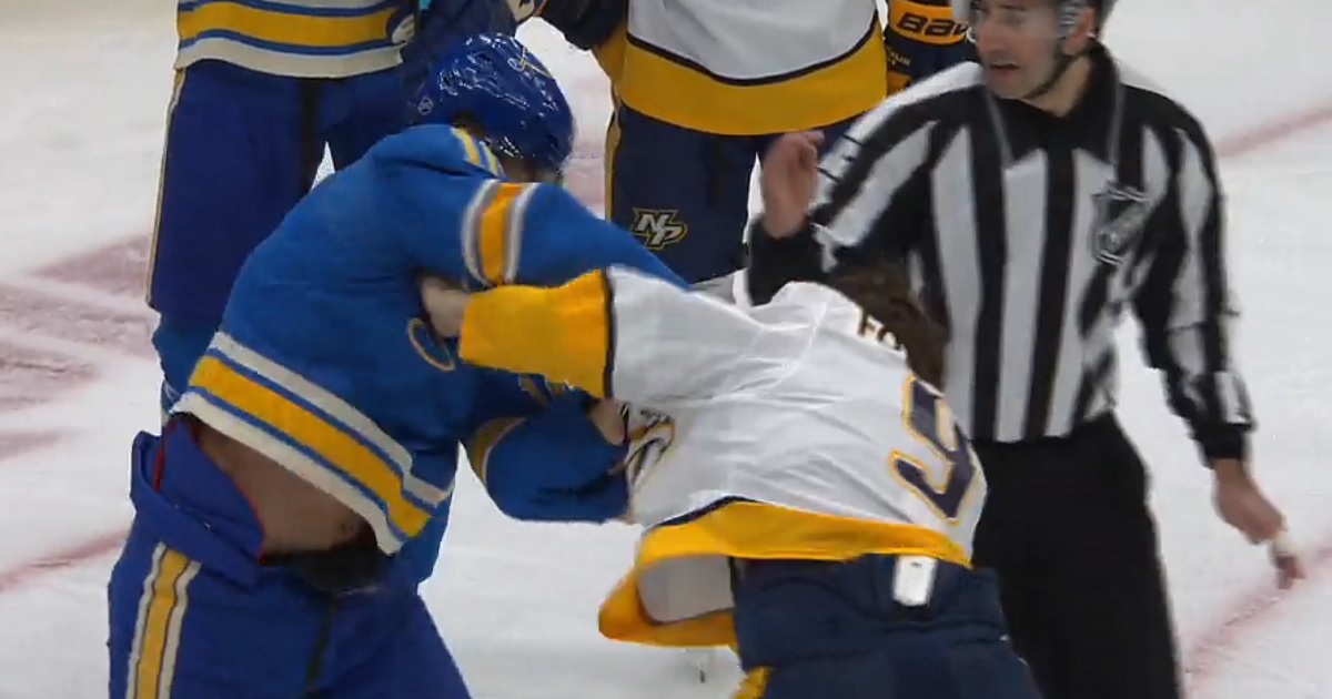 Filip Forsberg and Brayden Schenn drop the gloves in front of the Blues net. 