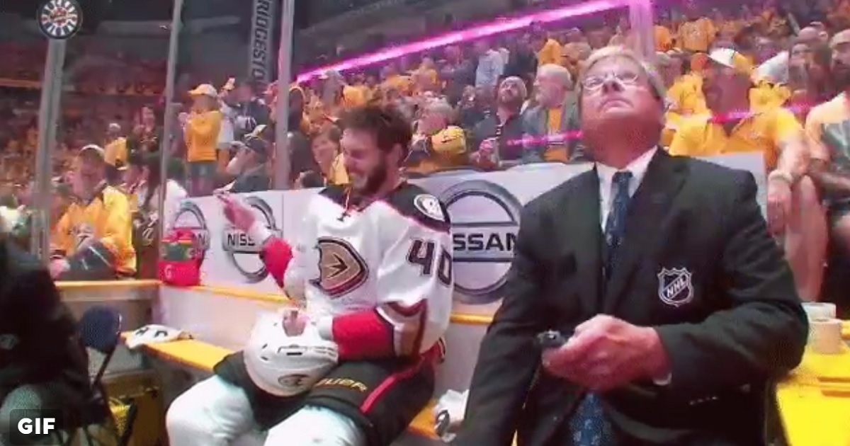 Jared Boll laughs at Predators fans from the penalty box after his team scores a goal.