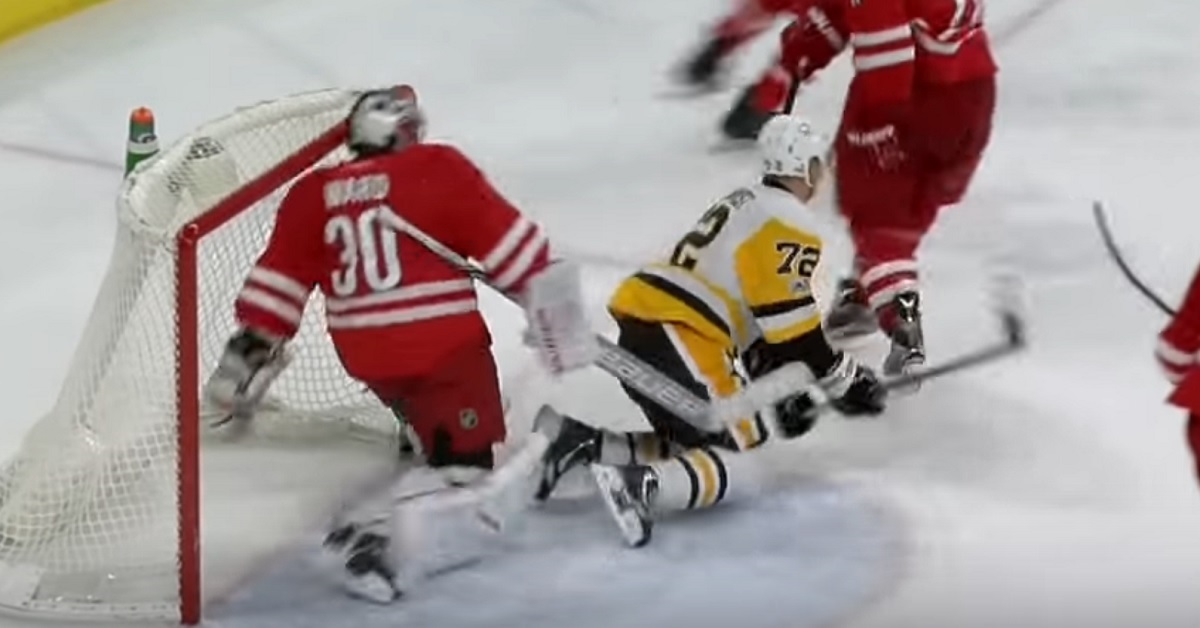 Cam Ward gets away with a slash to the back of Hornqvist's leg.