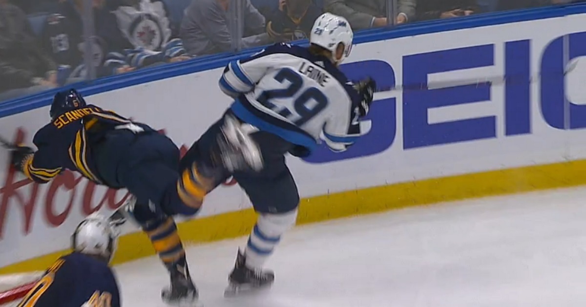 Huge hit from Laine sends player to the locker room. 