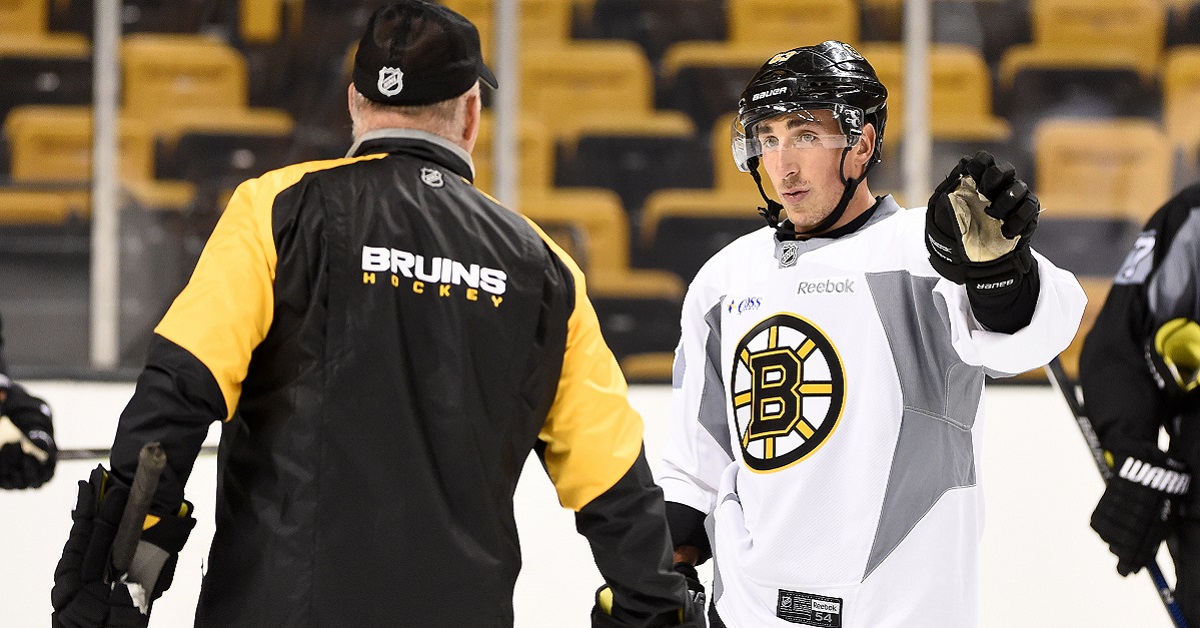 Cameras catch a hilarious moment between Brad Marchand and his coach.