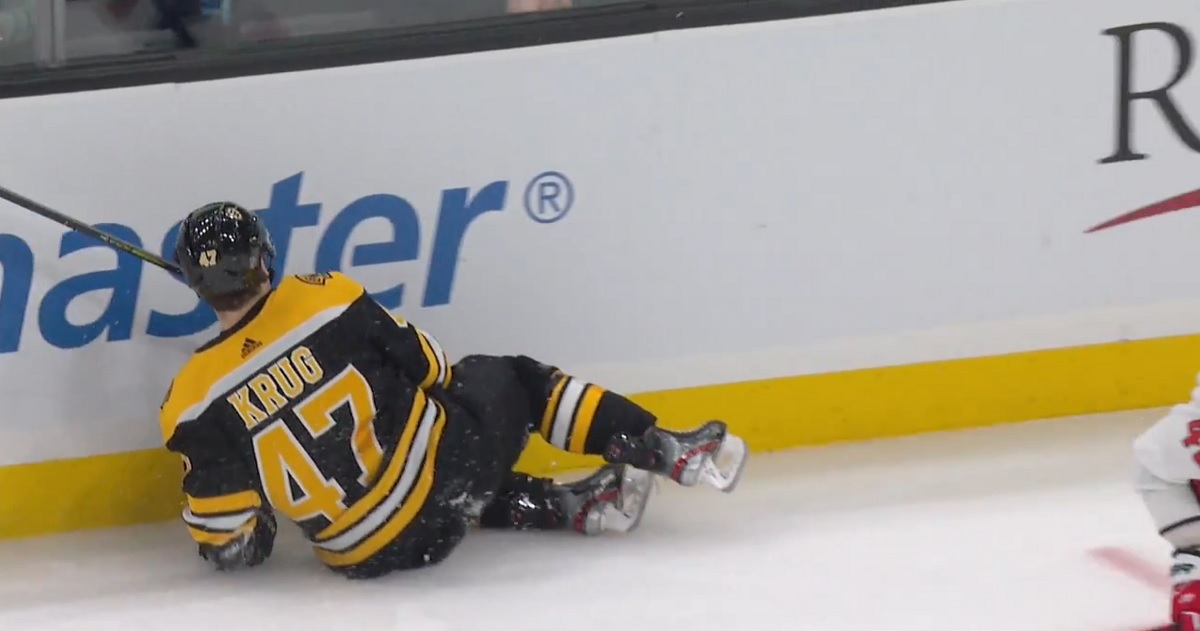 Torey Krug leaves the game after a big hit from Tom Wilson.