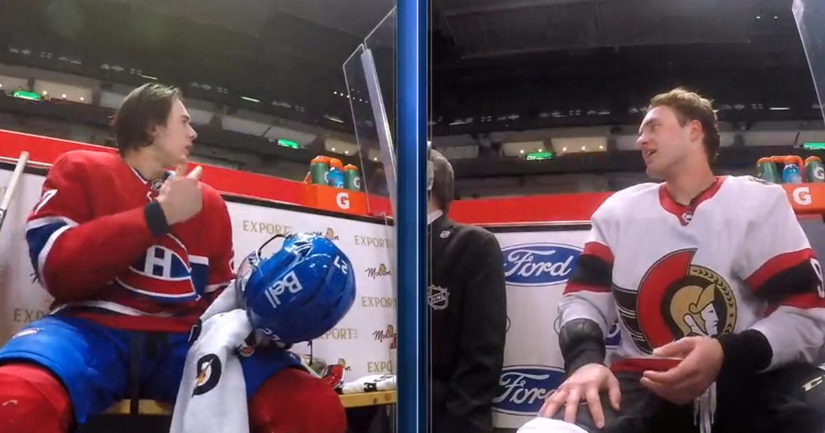 Josh Norris taunts Alexander Romanov in the penalty box.