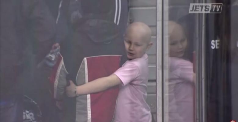 VIDEO: Young Jet fan's good heart earns him a hug from a sick little girl.