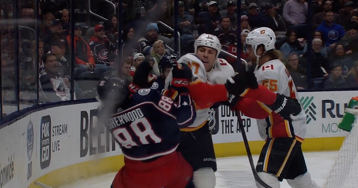 Milan Lucic with a vicious sucker punch to the face of Kole Sherwood.