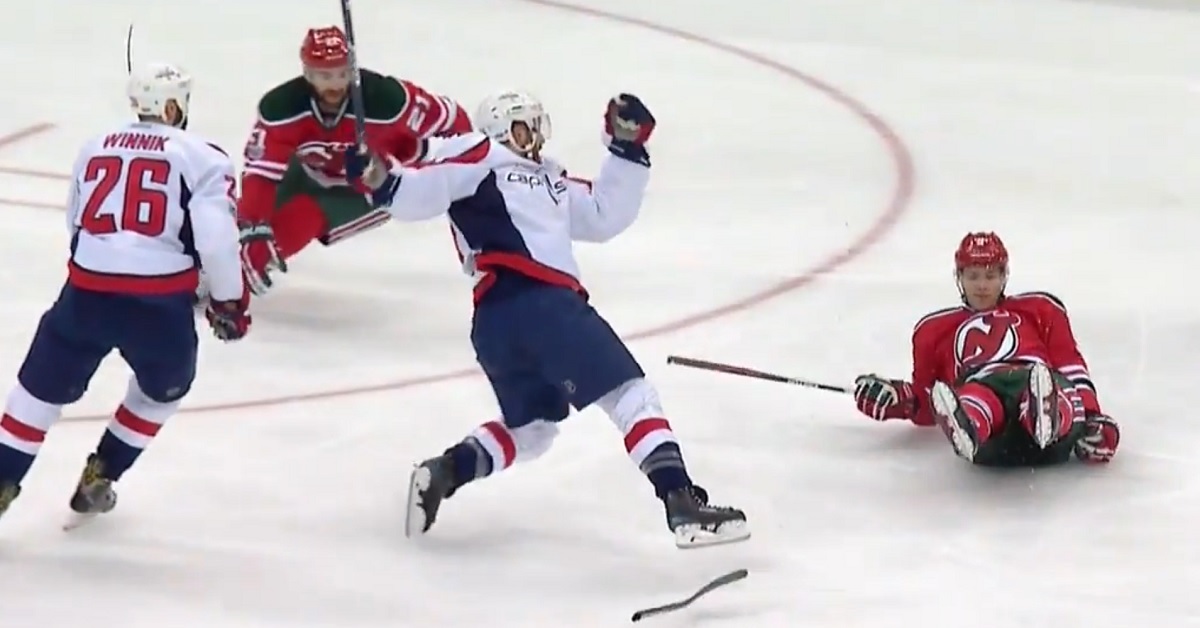 Taylor Hall gets hit so hard his stick explodes.