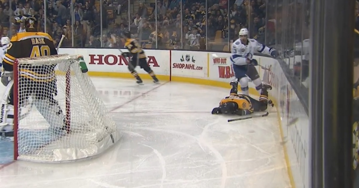 Torey Krug gets drilled from behind, goes head first into the boards.