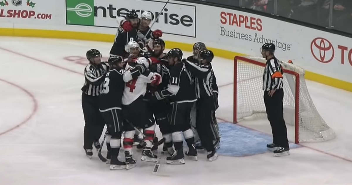 Quick loses his cool and breaks Wood's stick with one hand.