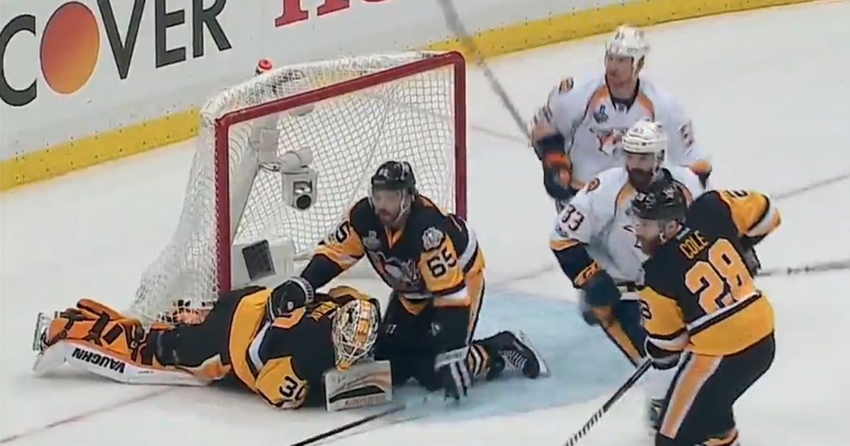 Penguins goalie slow to get up after taking the post right between his legs.