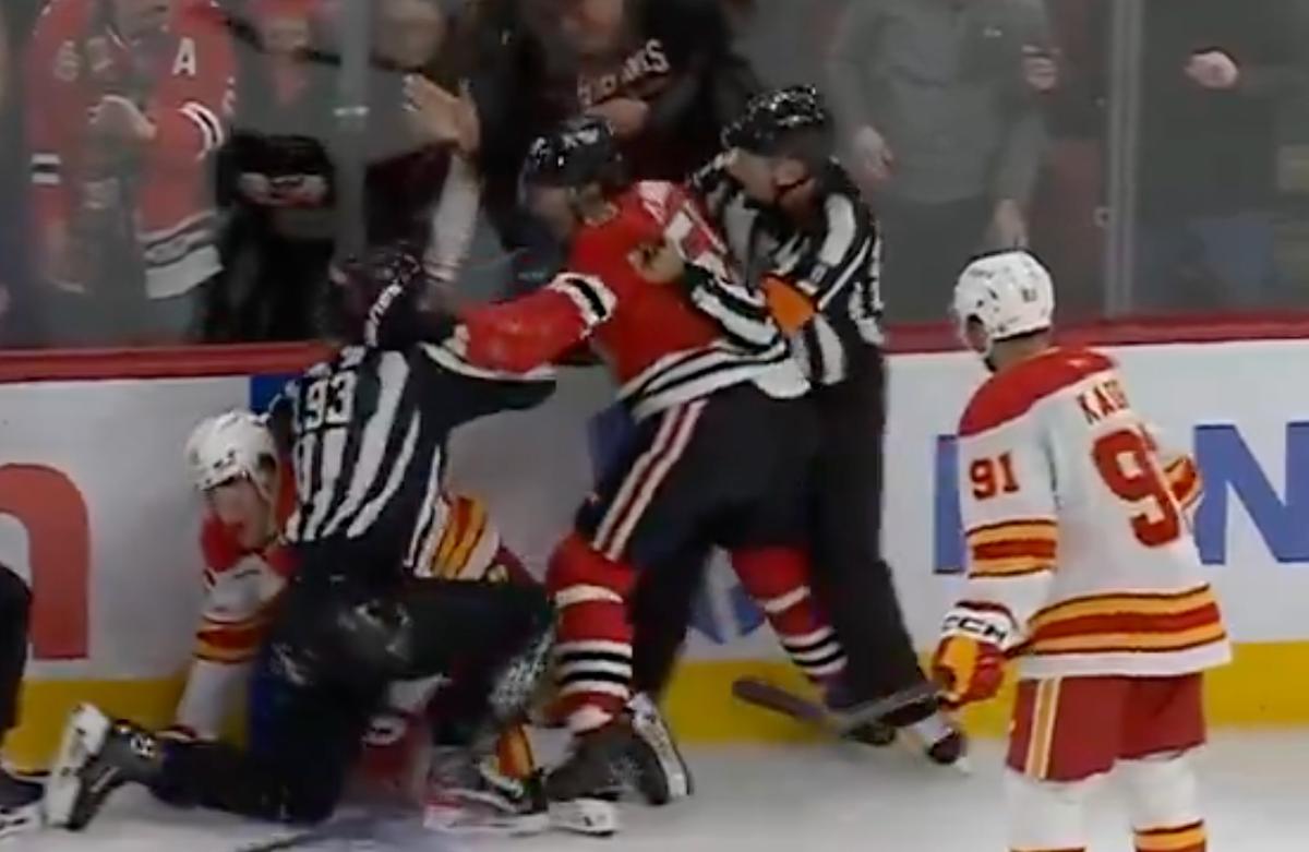 Artyom Levshunov swiping at a linesman. 